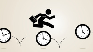 Silhouette of worker holding briefcase leaping over clocks with increasing times