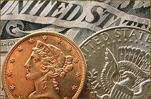 Close up of two collectible coins resting on U.S. paper currency